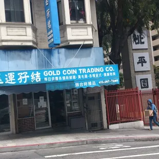 a man walking in front of a building