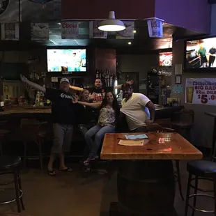 a group of people at a bar