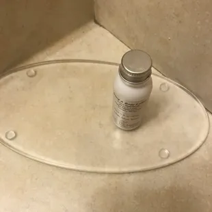 Used bottle of lotion is the only toiletry here.