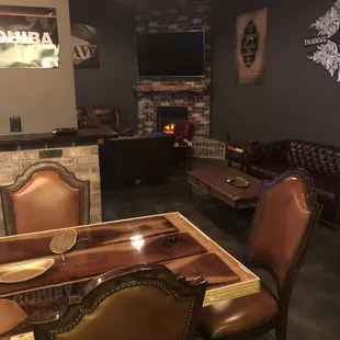 leather chairs and a fireplace