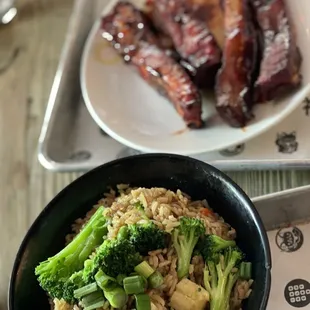 a bowl of rice with broccoli and meat