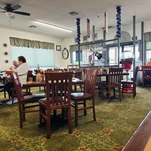 people sitting at tables and eating