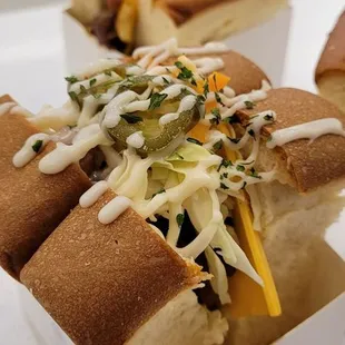 three hot dogs in a box