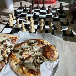 a pizza and chess board