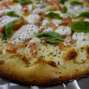 "White Rock Pizza".  Garlic&amp;Italian olive oil base, topped with Mozzarella Cheese, Tomato, Ricotta Cheese, finished with dry and Fresh Basil