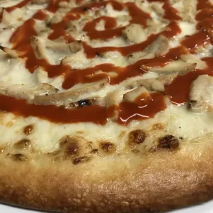 "Buffalo Chicken Pizza" Blue Cheese Sauce Base, Mozzarella Cheese, Grilled Garlic Chicken, Drizzled with Frank's Buffalo Sauce.