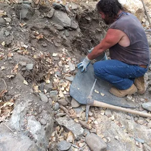 Guide Mike digs out some material for you to pan for gold.