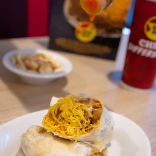 a burrito on a white plate