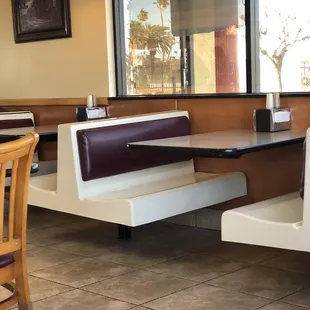 Booth Seating Around Perimeter, Table and Chairs in Interior