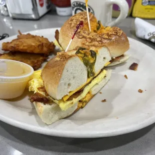 Jalapeño bagel w egg n bacon and potato latke- yummy!!