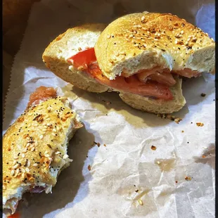 Everything bagel toasted with cream cheese, lox, onion and tomato.  So delicious