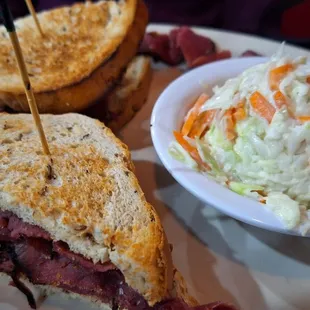 Pastrami on rye with coleslaw and a pickle spear