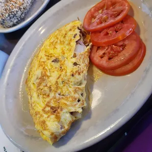 an omelet and tomatoes