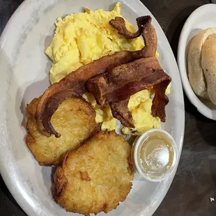 Scrambled eggs, latkes, crisp bacon and bagel