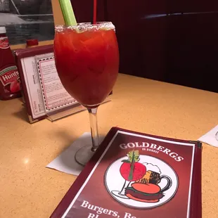 20 ounce Bloody Mary with celery, lime, olive and a salted rim. A bit spicier than I love but remedied with a small glass of tomato juice.