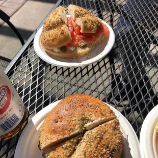 two plates of bagels and a beer