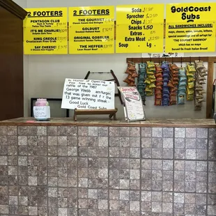 a counter with a lot of food on it