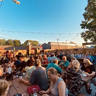 a large group of people eating outside