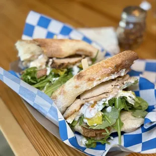 Döner kebab sandwich - Wood fired chicken, feta, onion, tomato, pepperoncini, arugula, garlicky cream sauce