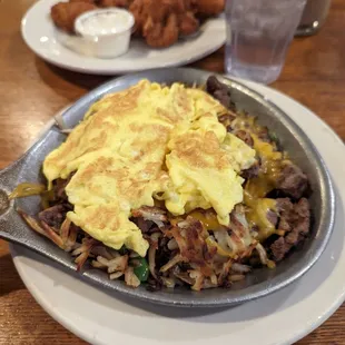 Steak Skillet, my friend got wings with some other stuff