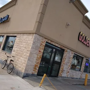 a bicycle parked outside of the building