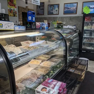 a display case with a variety of foods