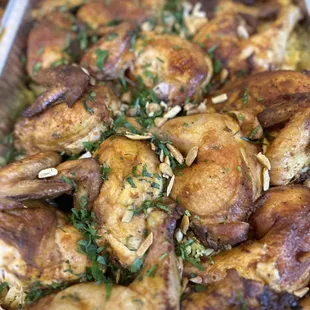 a tray full of baked chicken