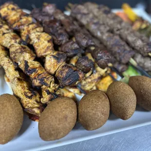 a platter of meat and vegetables