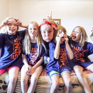 A group of campers having fun with their camp counselor!
