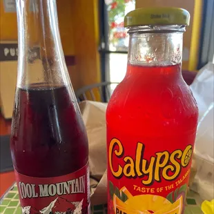 a bottle of calypee and a bottle of soda