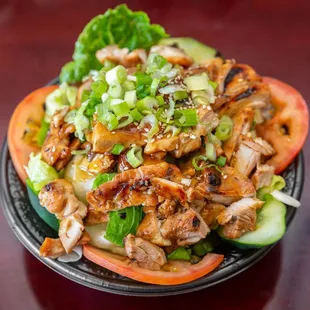 a plate of food with meat and vegetables