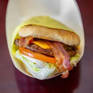 a bacon, lettuce, tomato, and cheese sandwich