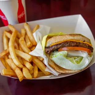 a hamburger and french fries on a table