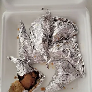Foil wrapped chicken.   It has sauce inside.