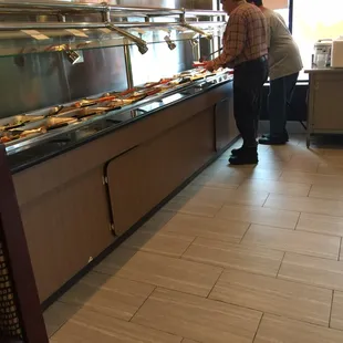 a man preparing food in a restaurant