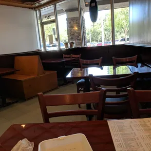 Interior seating, 2 tables and 2 booths