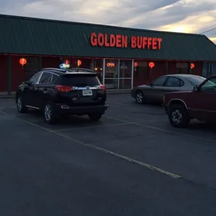 cars parked in front of the restaurant