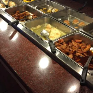 a variety of food in a buffet