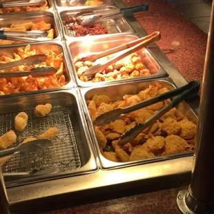 a variety of food items in a buffet