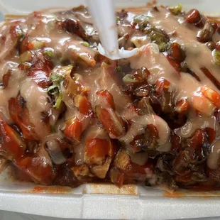 Large combo beef and teriyaki bowl, topped with thousand islands and sriracha sauce. All over white rice...