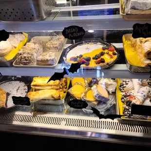 a variety of pastries in a display case