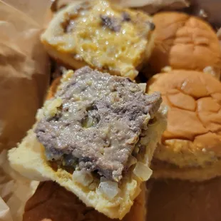 a variety of hamburgers in a basket