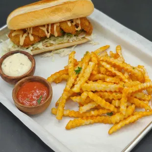 Golden Catch offers delicious seafood sandwiches with coleslaw, pickles, and bang bang sauce. Don't forget to add avocado!