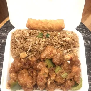 Orange chicken dinner with chicken fried rice and an egg roll