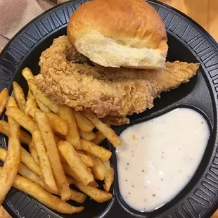 Chicken tender mea with fries.