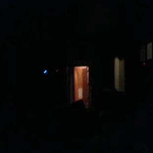 an open door in a dark room