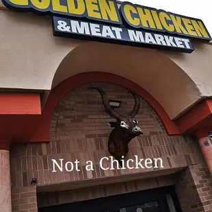 What is that horned creature above the entrance