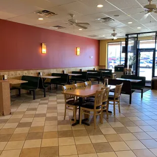 a restaurant with tables and chairs