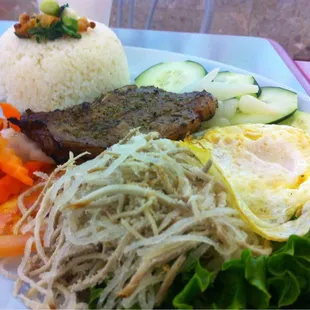 Com tam bi op la suon nuong grilled pork chop and broken rice.