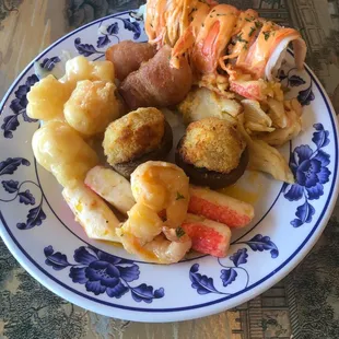 S8. Coconut Shrimp, Bacon Wrapped Chicken, S2. Seafood Delight, Sushi, Stuffed Mushrooms, Seafood with Mayonnaise.